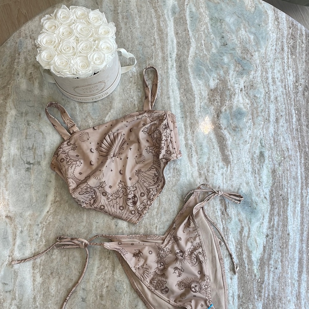NWT Bikini is tan color with sun moon stars and shells! ASOS design brand